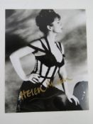 A hand signed photograph of Dame Helen Mirren DBE, autograph in gold pen.