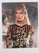 A hand signed photograph of Dame Helen Mirren DBE, autograph in gold pen.