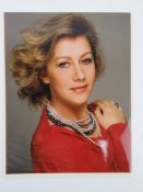 A hand signed photograph of Dame Helen Mirren DBE, autograph in gold pen.