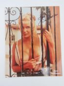 A hand signed glamour photograph of June Wilkinson, autograph in black pen.