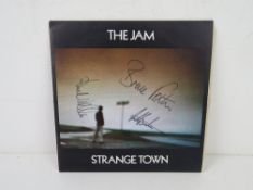 The Jam; autographed 'Strange Town' vinyl single, hand signed to the front by Paul Weller,