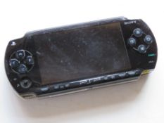 A Sony PSP in black, model PSP1004. D