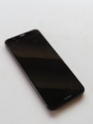 A Huawei mobile phone FIG LX1 in black.
