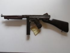 A deactivated Thompson M1A1 SMG. Latest