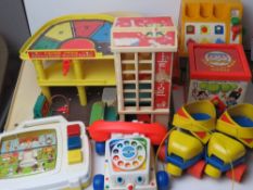 A quantity of Fisher Price toys inc parking garage, cash register, roller skates,