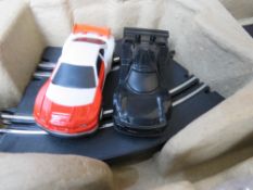 A Furious Challenger electric road racing set inc two cars, controllers and various track,