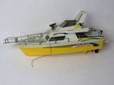 A Nikko Dolphin RC speedboat, controller deficient.