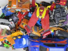 A large quantity of assorted metal and plastic toy vehicles inc Pixar Cars, Thomas & Friends, etc.