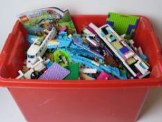 A large quantity of Lego Friends inc figures, bus, car, Aeroplane, train track, etc.