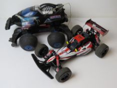 Two remote control vehicles, being Topmax Racing,