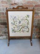 A c1930s fire screen measuring approx 50cm wide.