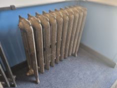 A refurbished cast iron Victorian column radiator having ten fins in floral pattern and integral