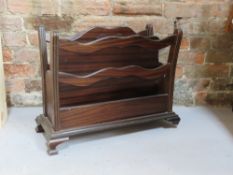 A magazine rack, one foot a/f and measuring approx 54cm wide.