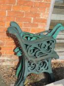 Two matching pairs of bench ends together with another pair in same style having different paint