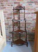 A What-not having carved and turned decoration, measuring approx 45 x 150cm.