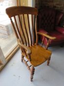 A high backed carver chair measuring approx 113 x 61cm.