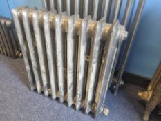 A refurbished cast iron Victorian column radiator having nine fins and measuring 63cm wide,