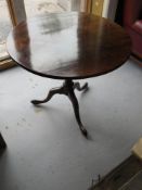 A tilt-top occasional table. Measuring approx 80cm dia x 72cm.