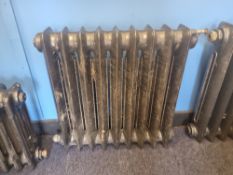 A refurbished cast iron Victorian column radiator having nine fins and measuring 63cm wide,