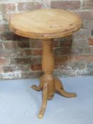 A pine occasional/wine table measuring approx 45cm dia x 63cm high.