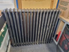 A refurbished cast iron Victorian column radiator having seventeen fins and measuring 102cm wide,