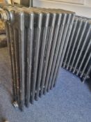 A refurbished cast iron Victorian column radiator having nine fins and measuring 56cm wide,