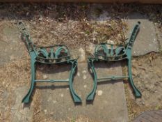 A pair of metal bench ends.