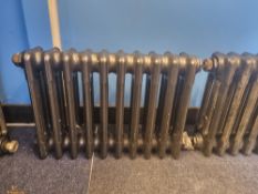 A refurbished cast iron Victorian column radiator having ten fins and measuring 63cm wide,