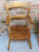 A carver type chair.