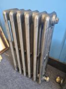 A refurbished cast iron Victorian column radiator having six fins and measuring 33cm wide,