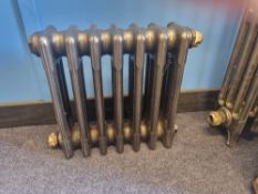 A refurbished cast iron Victorian column radiator having seven fins and measuring 46cm wide,