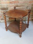 A side table raised over shaped pillars having under shelf and measuring approx 42 x 42 x 49cm.