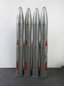 Four 40mm Bofors training rounds on clip