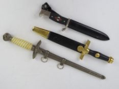 Three reproduction WWII German daggers;