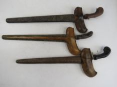 Three antique Kris knives with scabbards