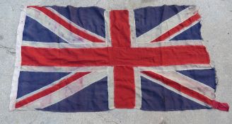 A British flag, a/f. Approx.162cm long a