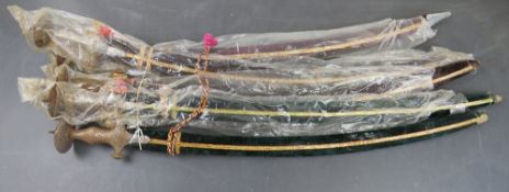 Five Tulwar swords with scabbards.