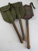 Three WWII US entrenching tools, two can