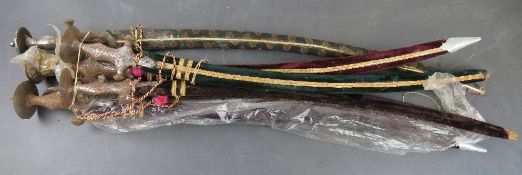 Five Tulwar swords with scabbards.