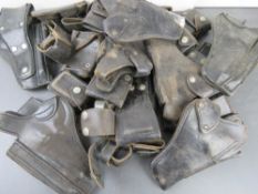 A quantity of leather holsters, ammo pou