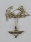A silver pendant in the form of a bumble bee on silver chain, stamped 925 throughout.