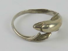 A ring in the form of a dolphin, no apparent hallmarks, size P-Q.