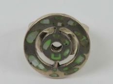 An abstract silver ring, chunky circular design set with mother of pearl, stamped 925, size M.