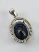 A blue stone pendant stamped 925, 2.8cm in length.