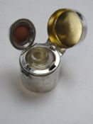 A HM silver travelling inkwell having rubberised seal cover, hallmarked London 1905.