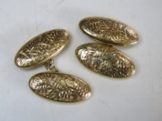 A pair of 9ct gold cufflinks having foliate pattern upon and hallmarked for Chester, 4.9g.