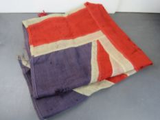 A British flag, a/f. Approx.162cm long a