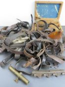 A large number of leather slings, wooden