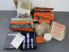 A box containing assorted militaria tool