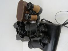 Thre binoculars all in cases, being Weig